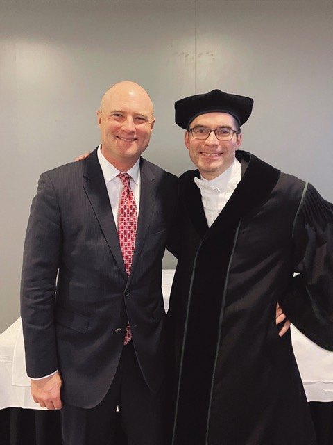 Dallas Thornton and Roland M. Mueller in academic gown